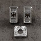 Billet Dyna axle adjuster blocks with stainless steel hardware and a specialty washer